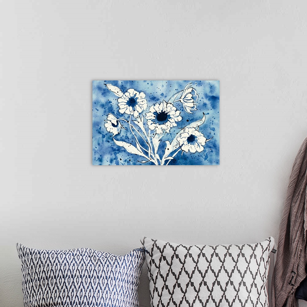 A bohemian room featuring Indigo and white watercolor painting of flowers with darker indigo paint splatter in the background.