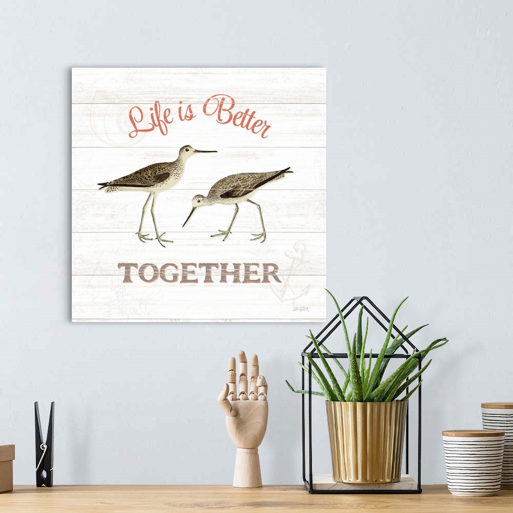 A bohemian room featuring Square beach decor with "Life is Better Together" written around an illustration of two sandpiper...
