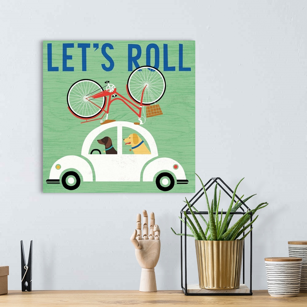 A bohemian room featuring "Let's Roll" illustration of two dogs driving a white beetle with a bicycle on top.