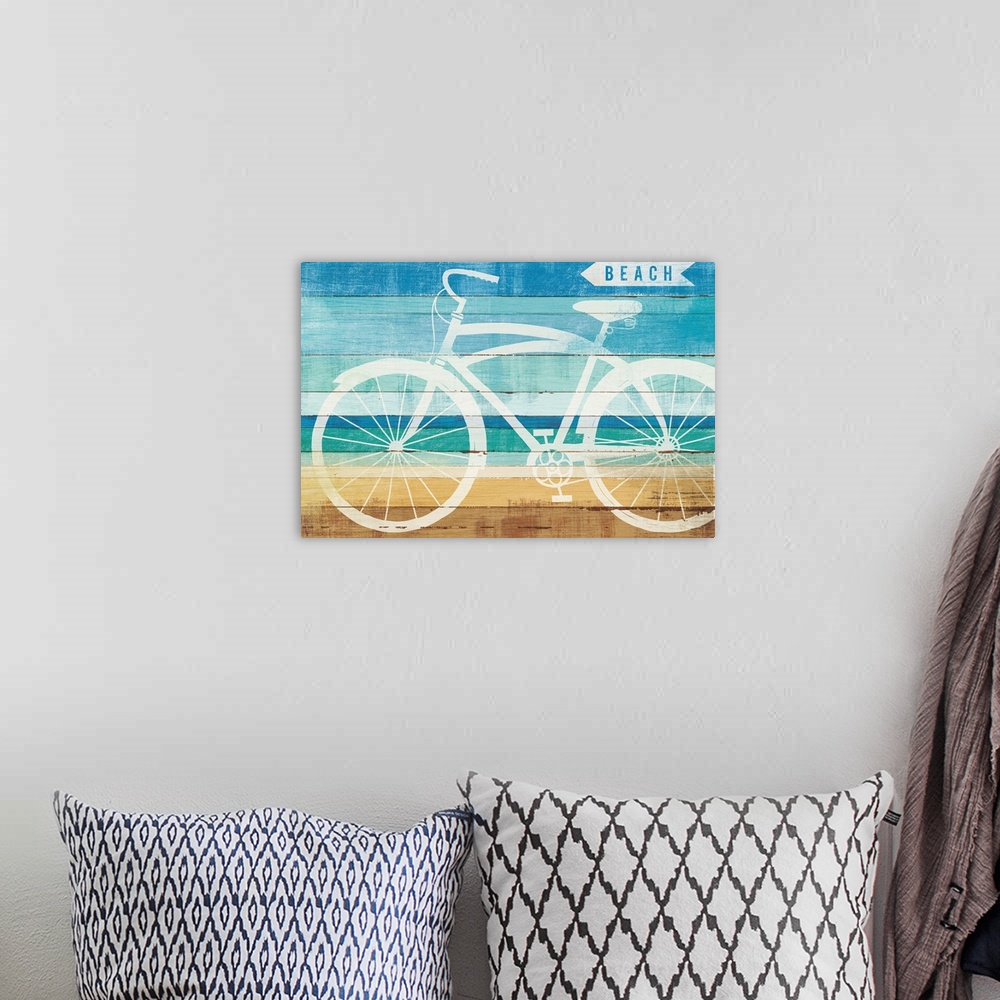 A bohemian room featuring White silhouette of a bicycle and a sign pointing to the beach on a wood panel background.