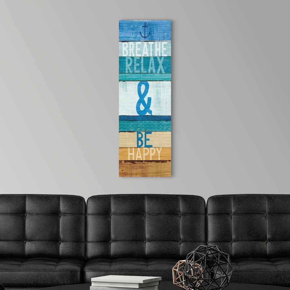 A modern room featuring "Breathe Relax and Be Happy" written on blue and tan rectangular shaped stained wood pieces.