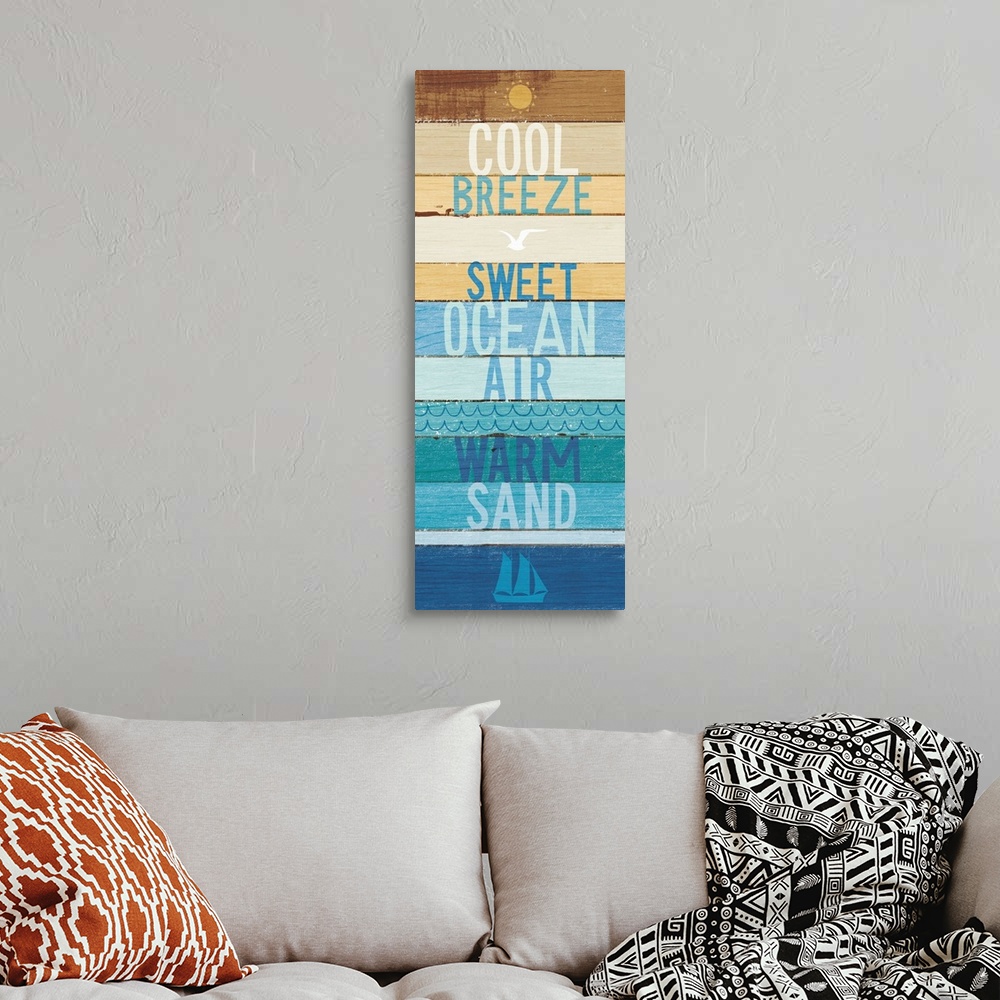 A bohemian room featuring "Cool Breeze- Sweet Ocean Air- Warm Sand" on a blue and tan wood paneled background.