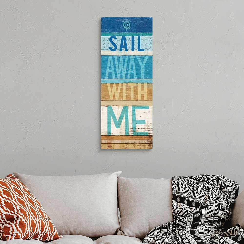 A bohemian room featuring "Sail Away With Me" on a blue and tan wood paneled background.