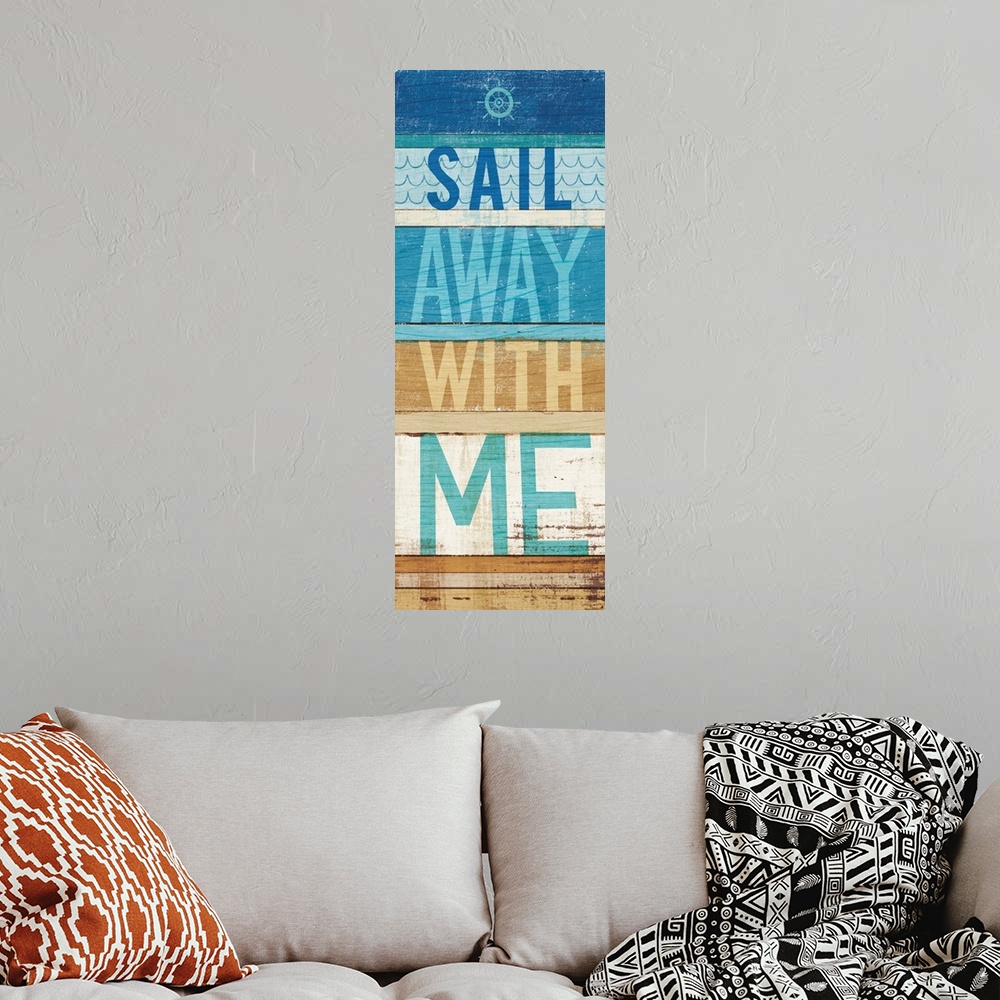 A bohemian room featuring "Sail Away With Me" on a blue and tan wood paneled background.