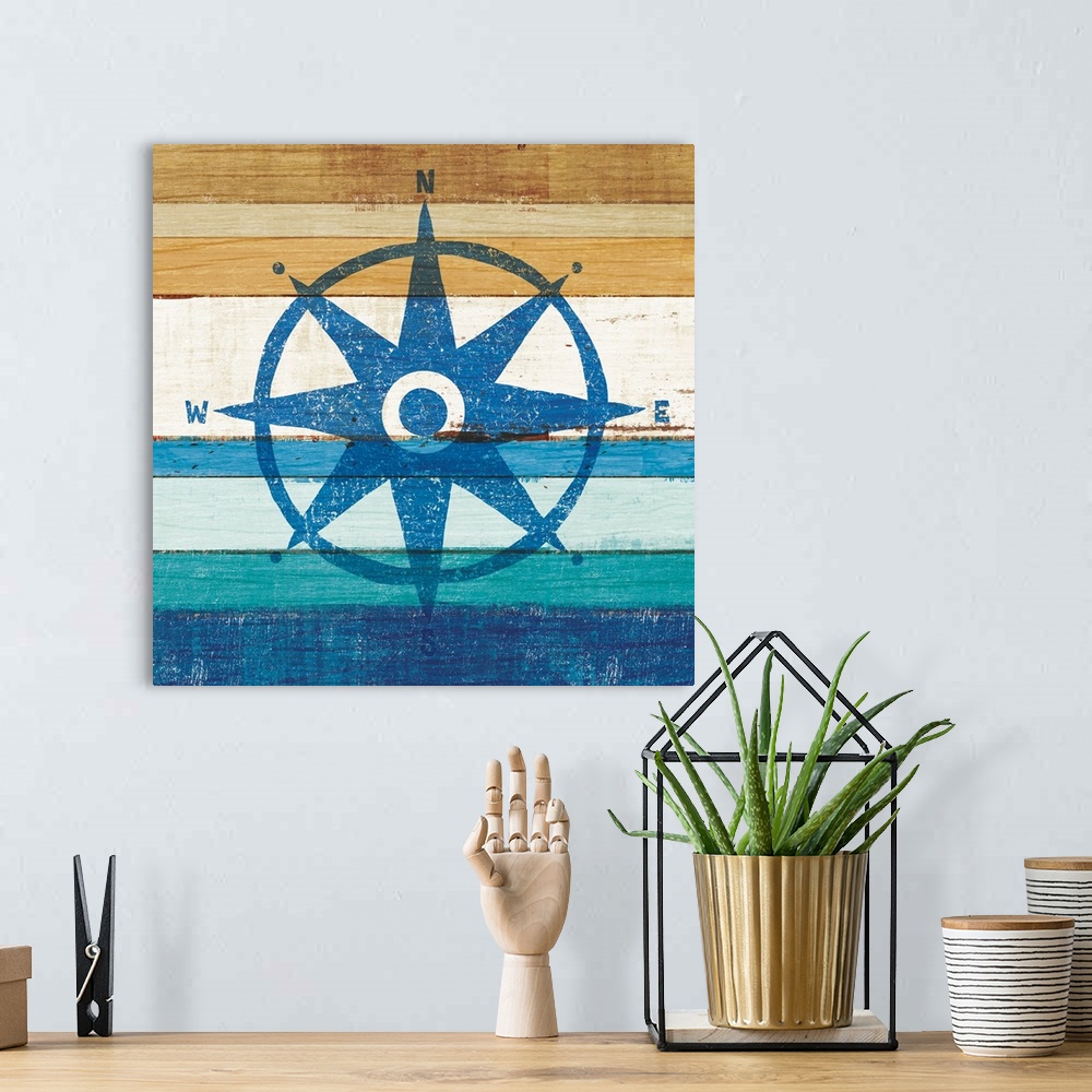 A bohemian room featuring Blue rose compass on a blue and brown painted wood background.