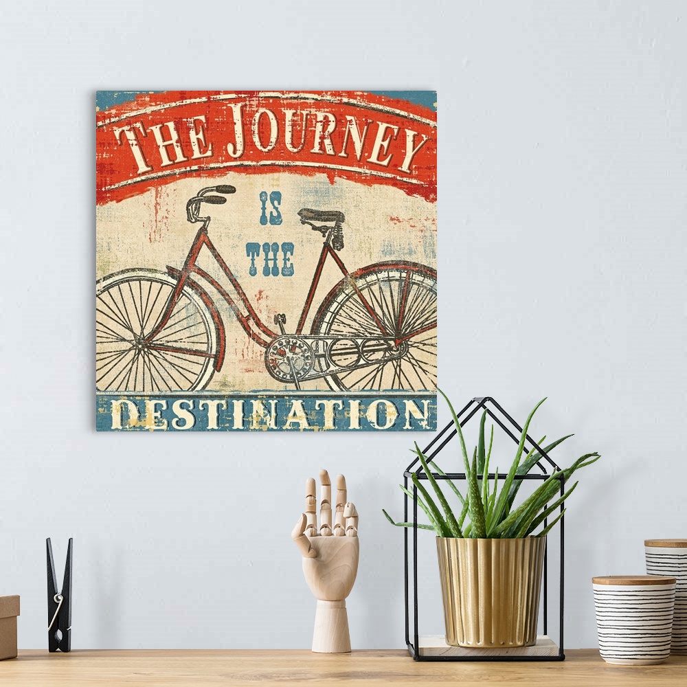 A bohemian room featuring Large vintage canvas art shows an illustration of a bicycle against a bare background with the te...
