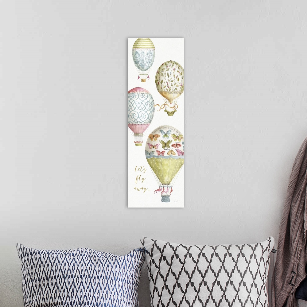 A bohemian room featuring Tall rectangular watercolor painting of four hot air balloons each with their own intricate desig...