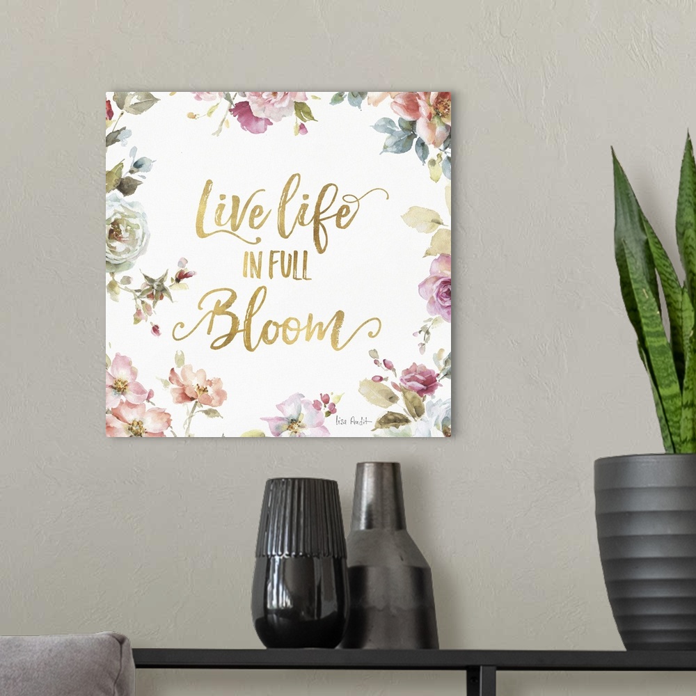 A modern room featuring "Live Life in Full Bloom" written in gold  and surrounded by a watercolor floral print.