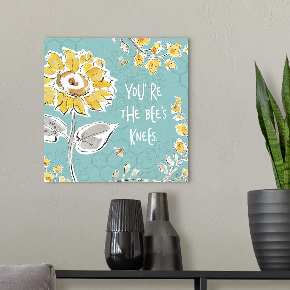 A modern room featuring "You're The Bee's Knees" written in white on a blue background with illustrations of yellow flowe...