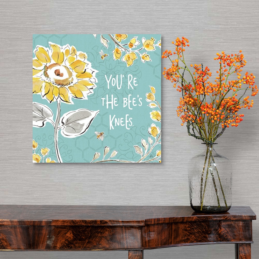 A traditional room featuring "You're The Bee's Knees" written in white on a blue background with illustrations of yellow flowe...