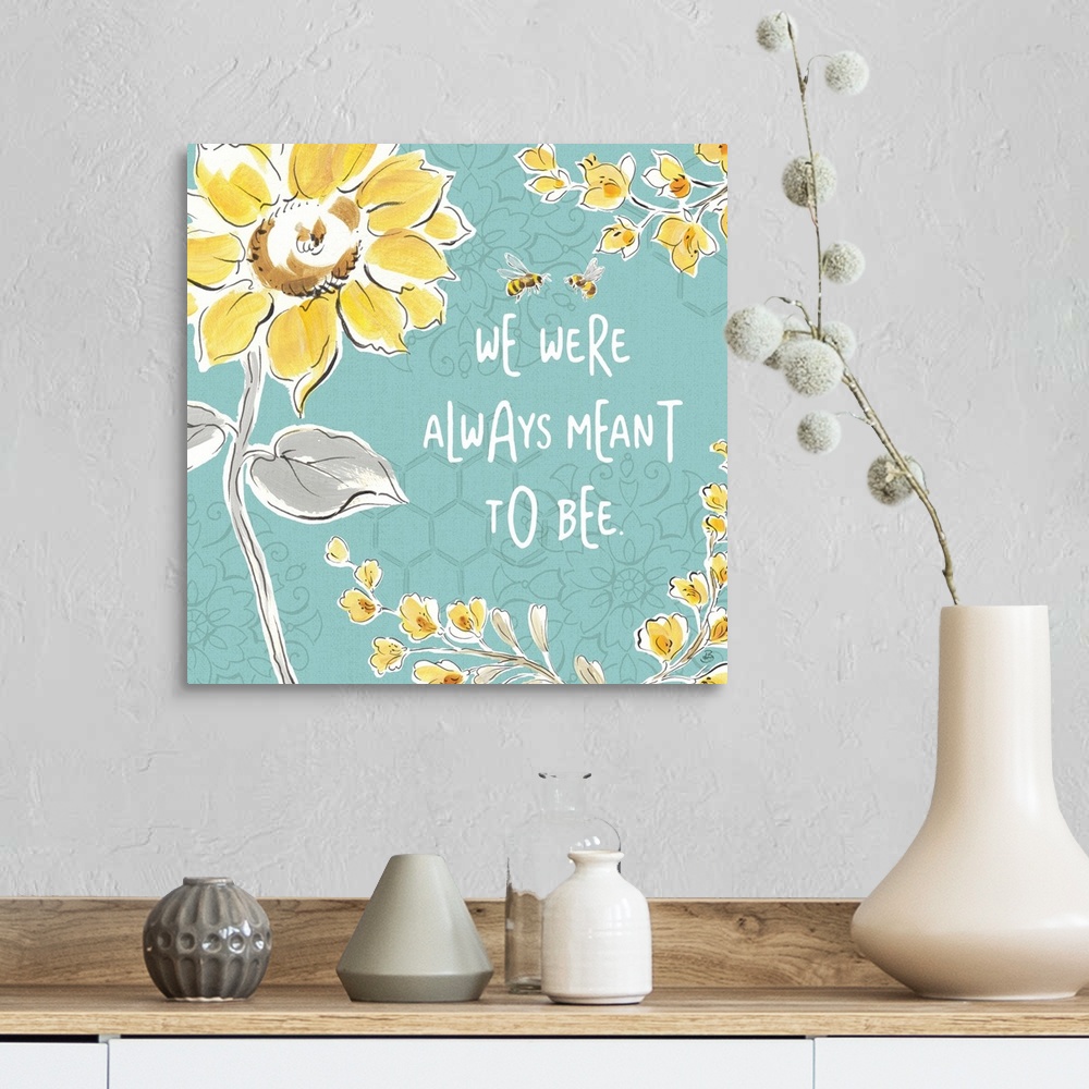 A farmhouse room featuring "We Were Always Meant To Be" written in white on a blue background with illustrations of yellow f...