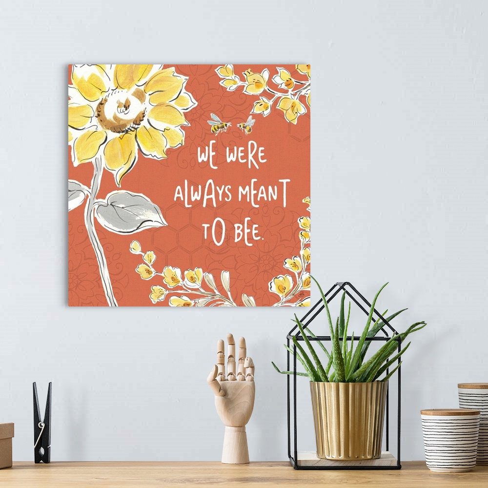 A bohemian room featuring "We Were Always Meant To Be" written in white on a dark coral colored background with illustratio...