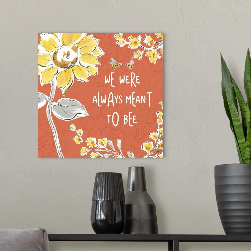 A modern room featuring "We Were Always Meant To Be" written in white on a dark coral colored background with illustratio...
