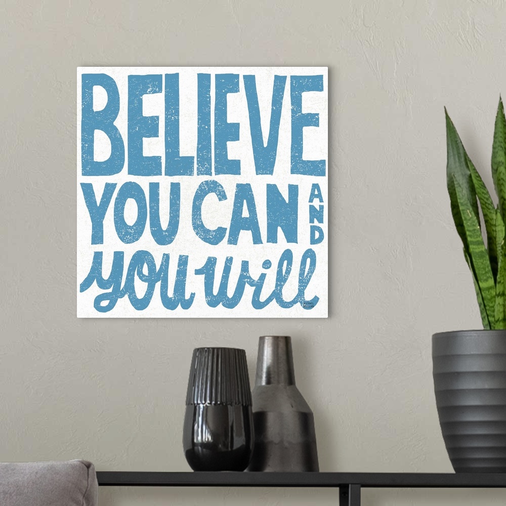 A modern room featuring Inspirational phrase in dark blue in hand-written block letters.