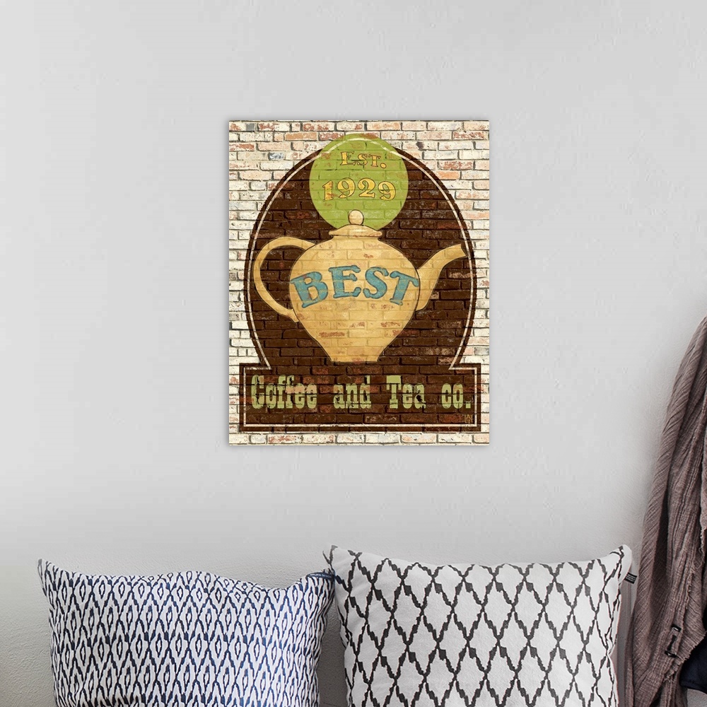 A bohemian room featuring Big canvas print of a a logo for tea and coffee painted onto a brick wall.