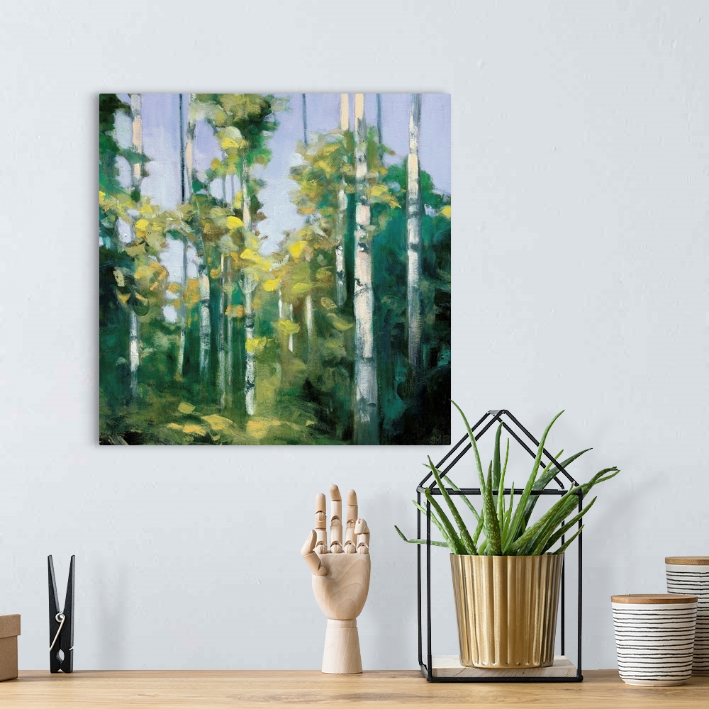 A bohemian room featuring Contemporary artwork of a forest of birch trees with green leaves.