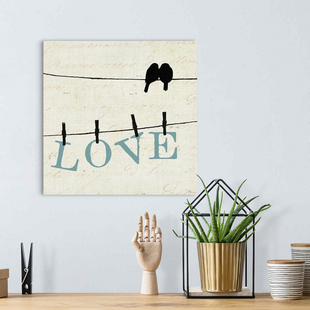 A bohemian room featuring Silhouette of two birds on a wire with another wire below them with letters pinned with clothespi...