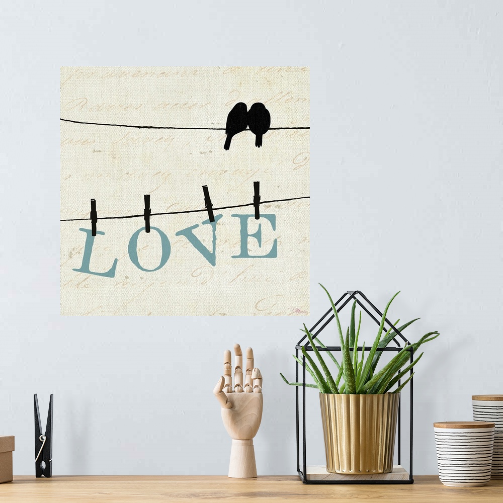 A bohemian room featuring Silhouette of two birds on a wire with another wire below them with letters pinned with clothespi...