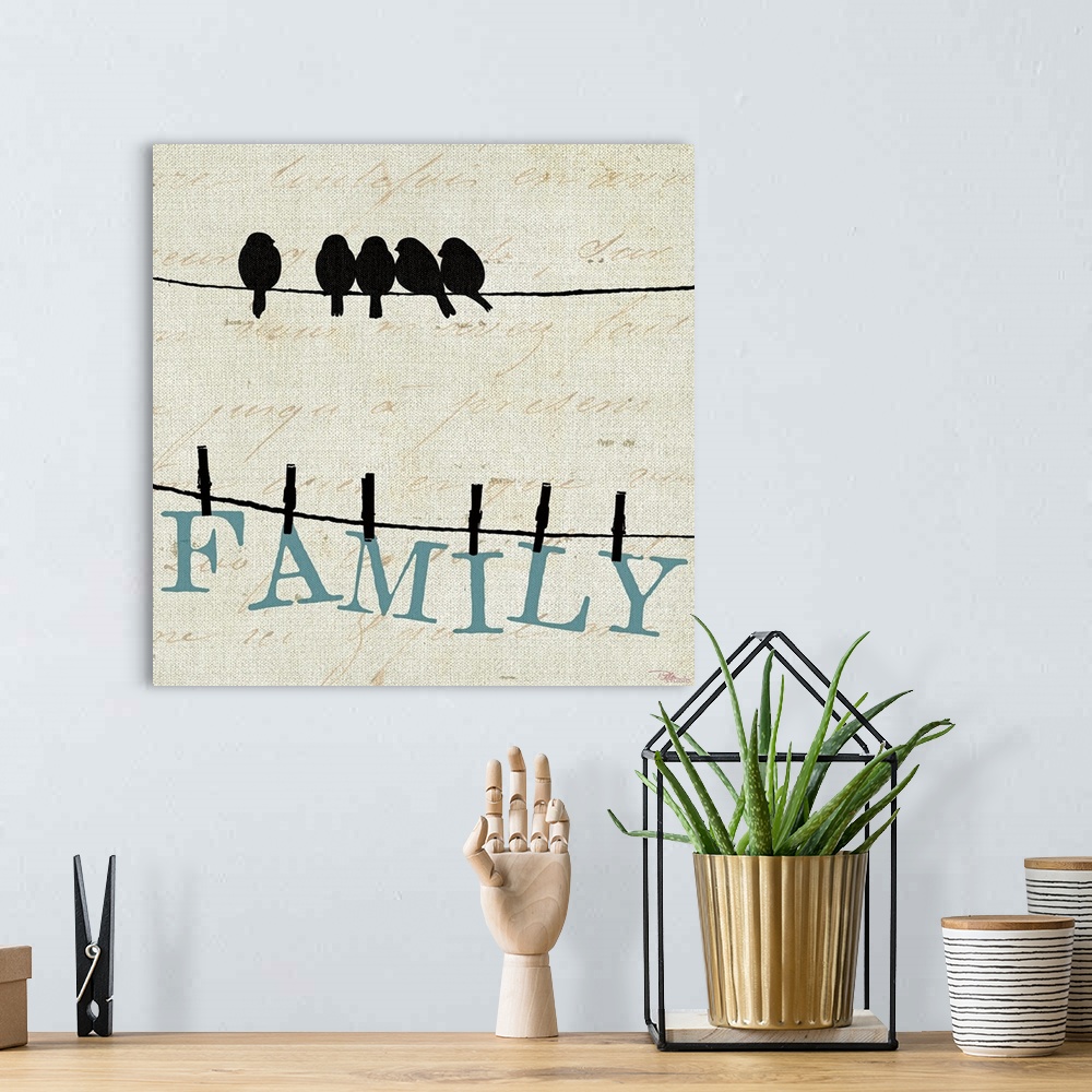 A bohemian room featuring Contemporary artwork of birds on a wire with the letters to spell out "FAMILY" clothes pinned to ...