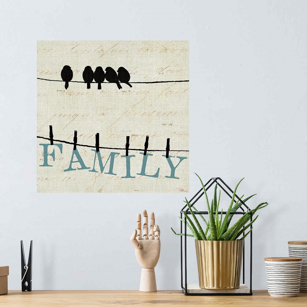 A bohemian room featuring Contemporary artwork of birds on a wire with the letters to spell out "FAMILY" clothes pinned to ...