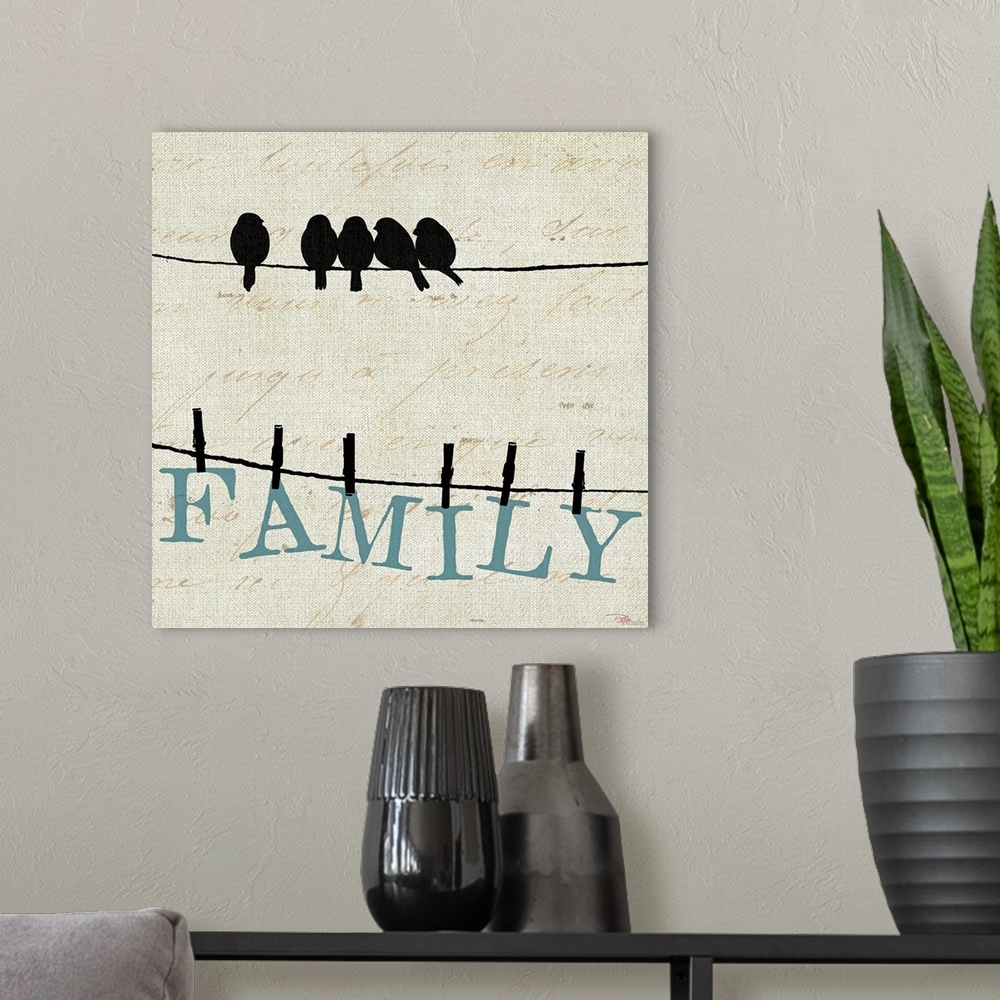 A modern room featuring Contemporary artwork of birds on a wire with the letters to spell out "FAMILY" clothes pinned to ...