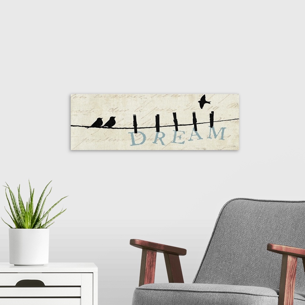 A modern room featuring Contemporary artwork of silhouetted birds on a wire with the word "Dream" hanging from the line.