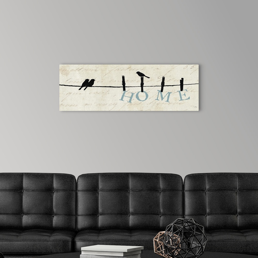 A modern room featuring Contemporary artwork of silhouetted birds on a wire with the word "Home" hanging from the line.
