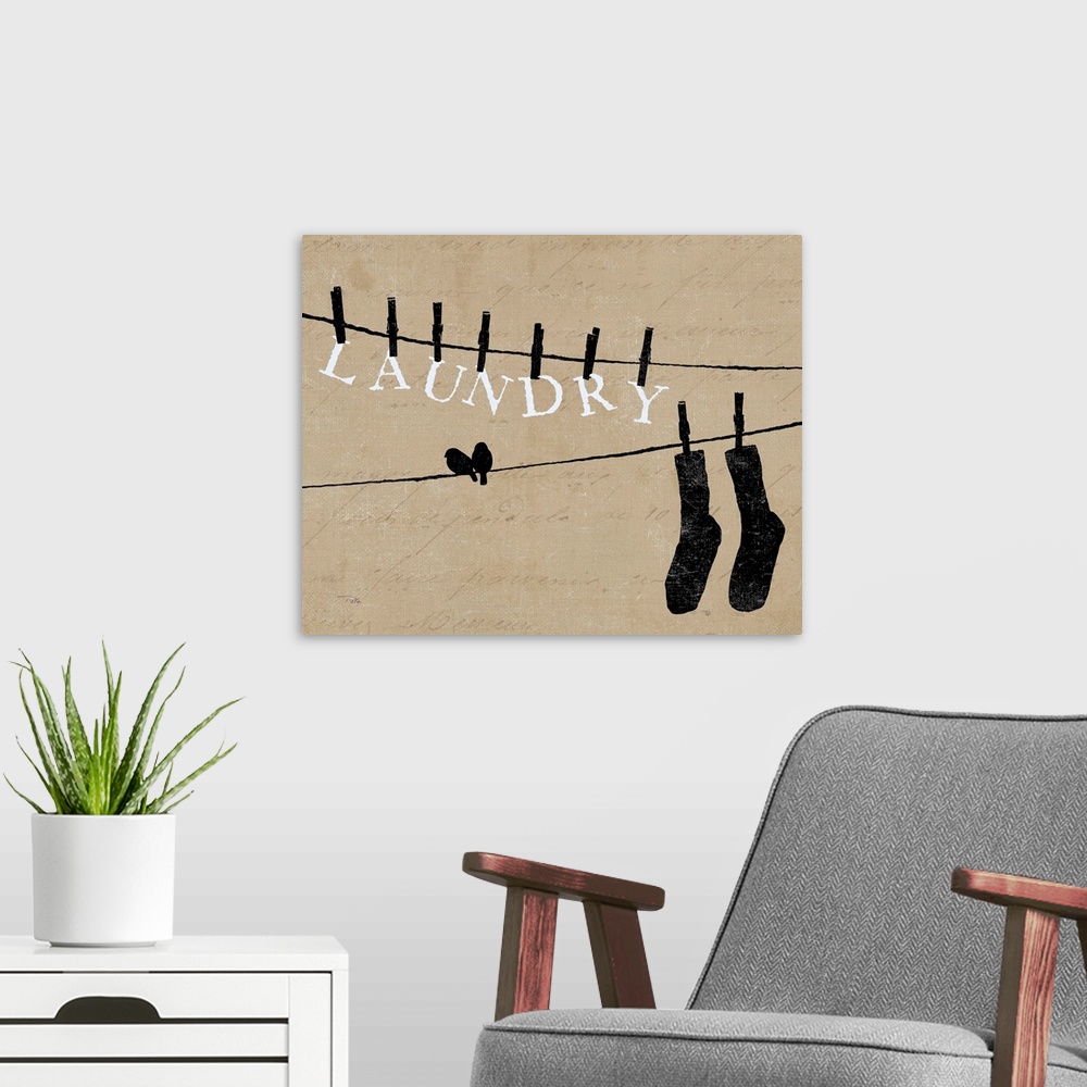 A modern room featuring Contemporary artwork of silhouetted birds on cloths lines, with words and a pair of socks hanging...
