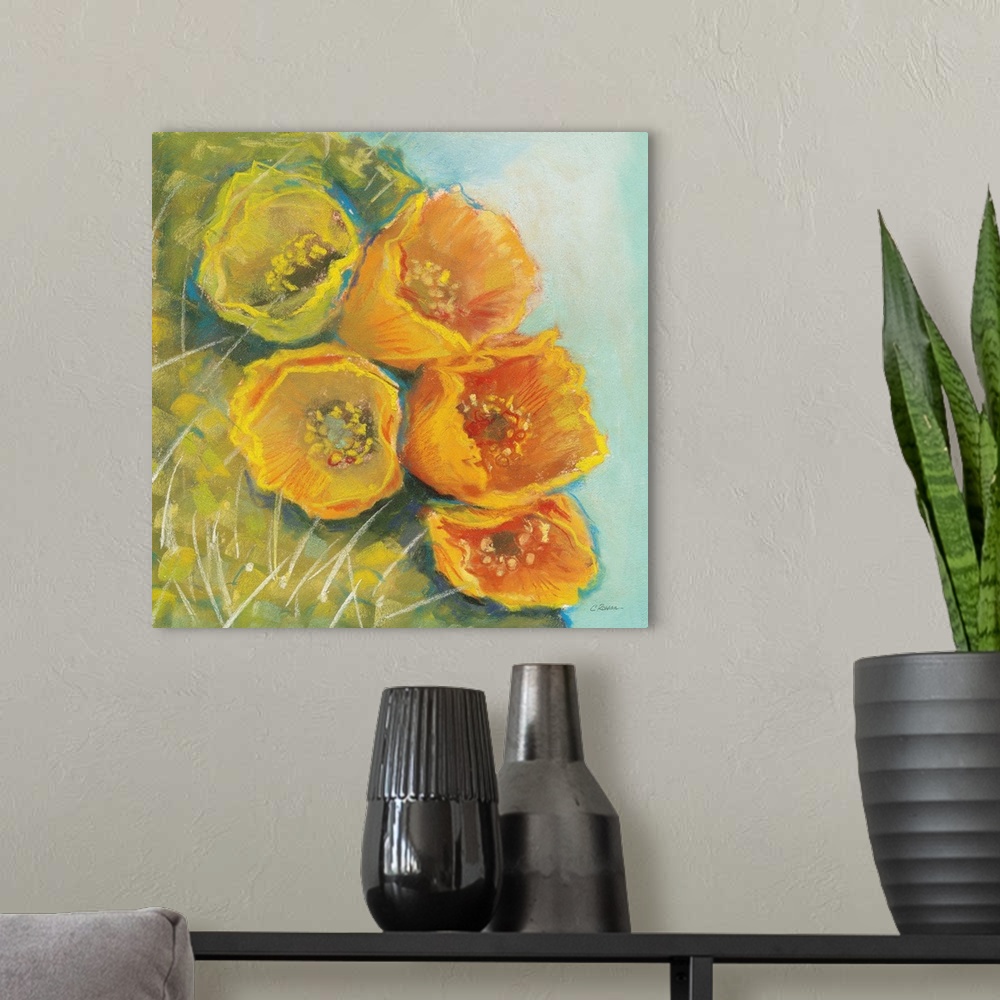 A modern room featuring A square contemporary painting of yellow blooms on a cactus with a blue background.