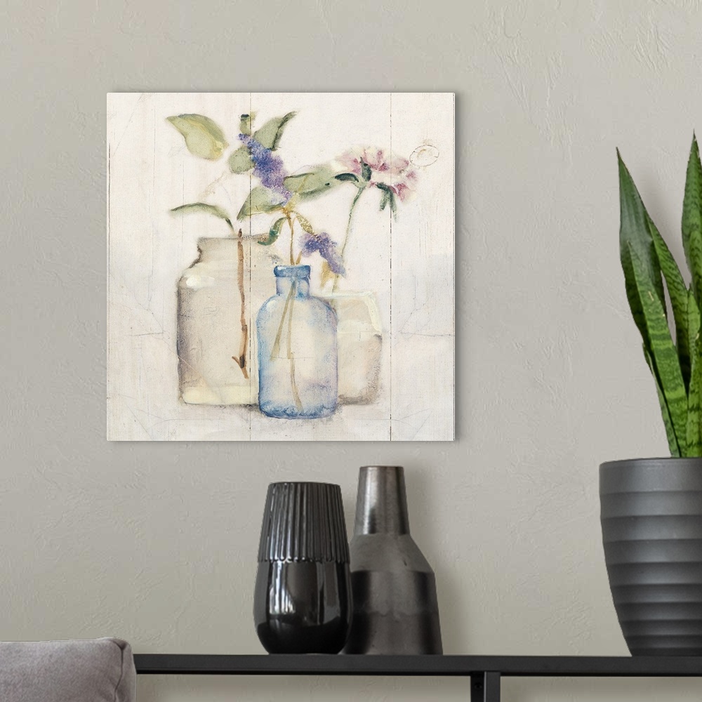 A modern room featuring Square artwork with flowers in glass vases on a rustic shiplap background.