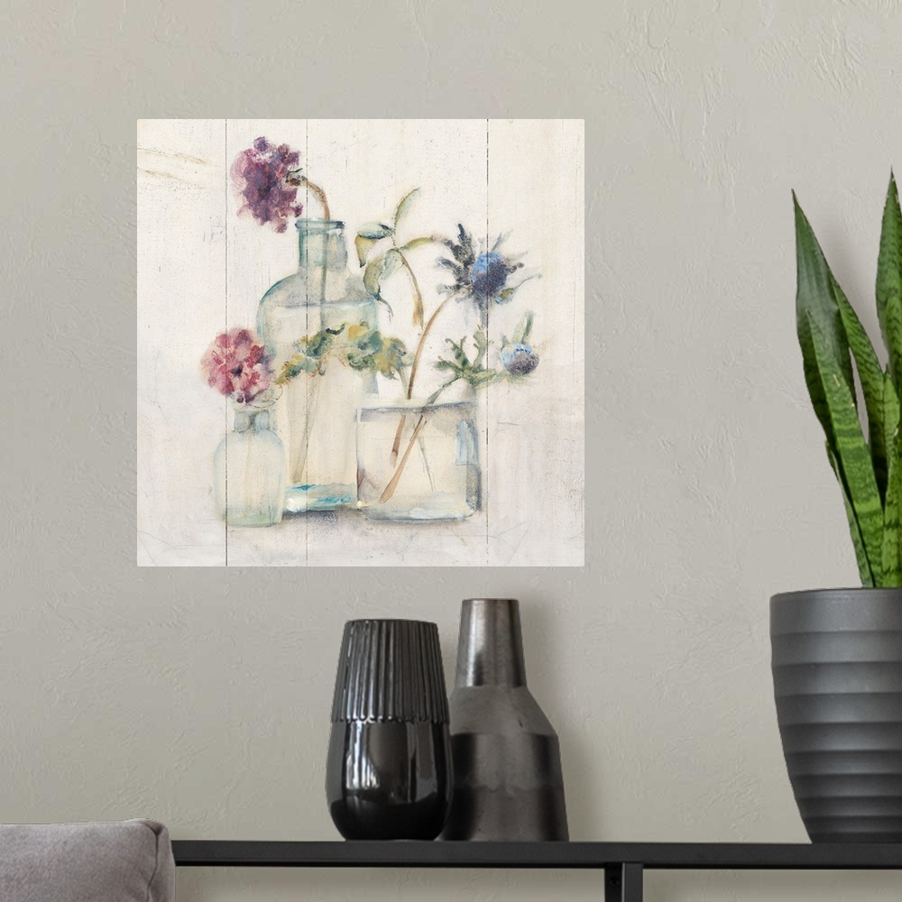 A modern room featuring Square artwork with flowers in glass vases on a rustic shiplap background.