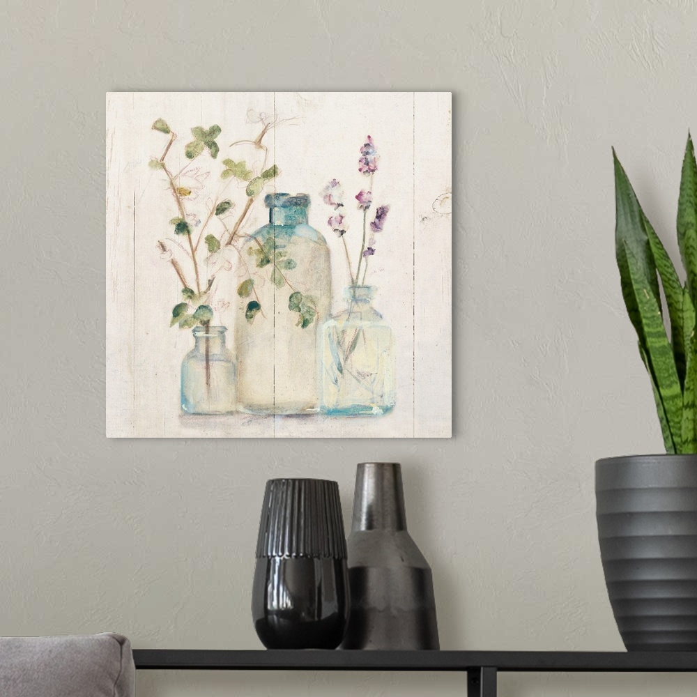 A modern room featuring Square artwork with flowers and branches in glass vases on a rustic shiplap background.