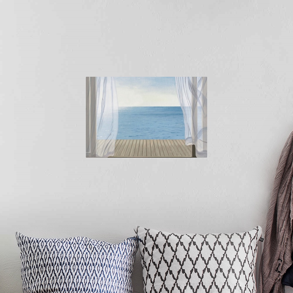 A bohemian room featuring Coastal artwork looking out over a calm sea from an open door.