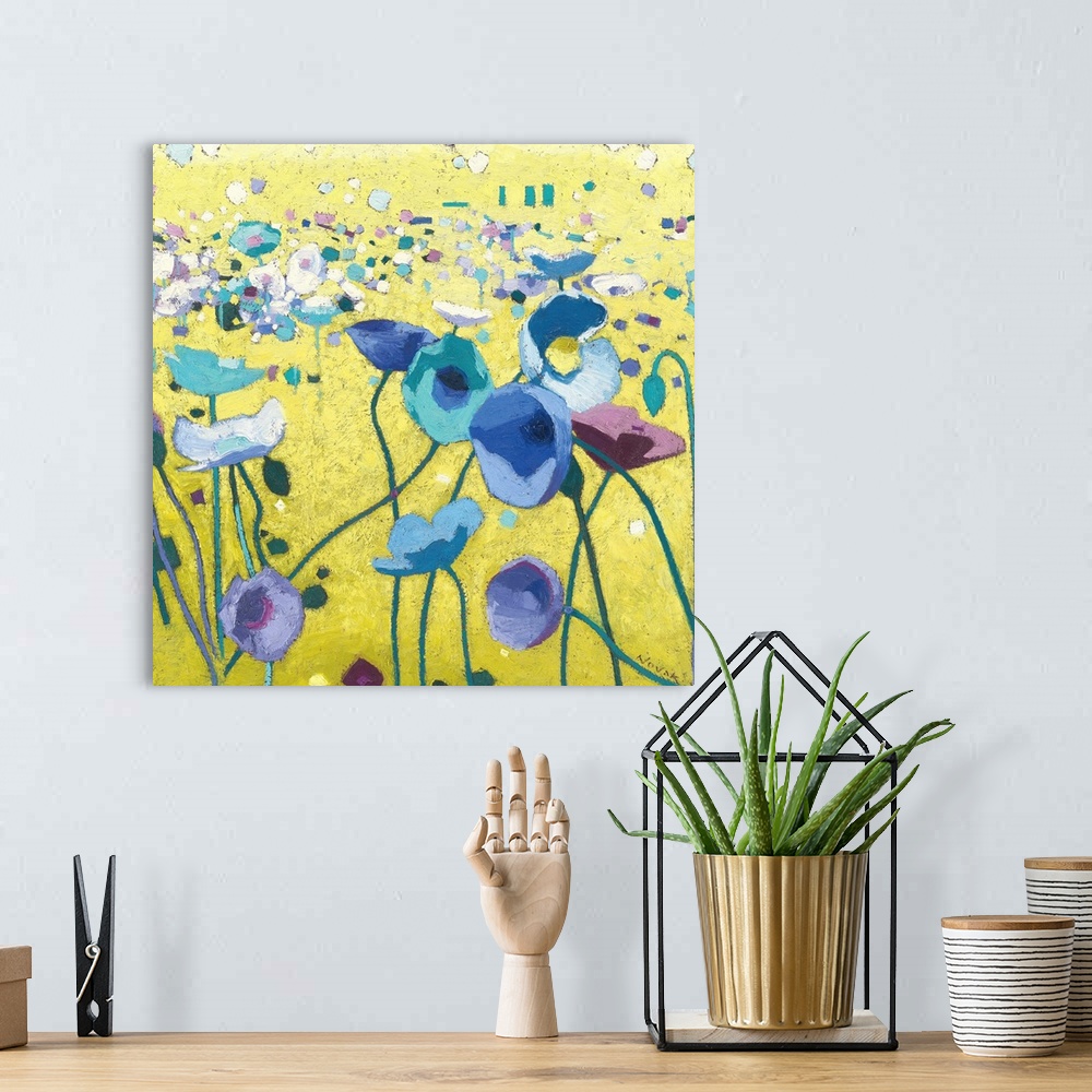 A bohemian room featuring Contemporary artwork of a field of blue poppies with long stems.