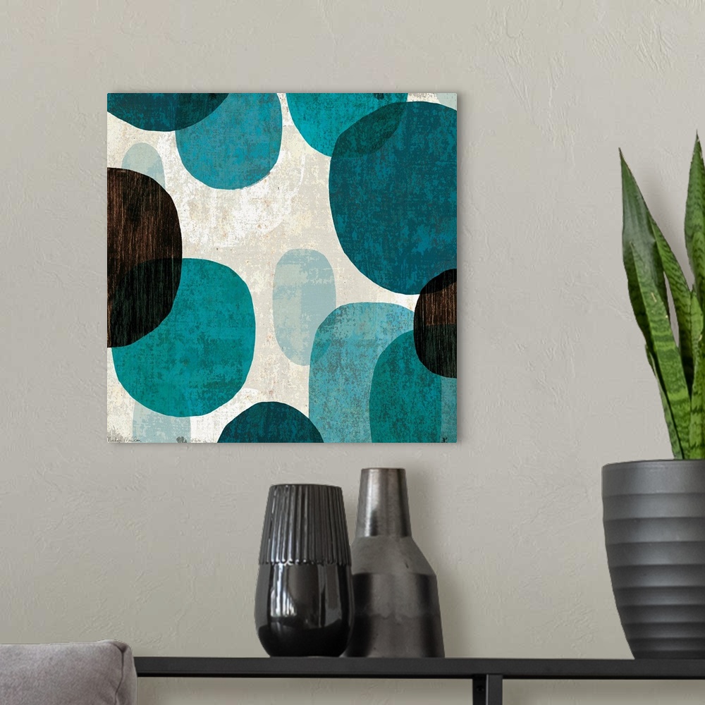 A modern room featuring Abstract art piece with large cool color ovals in varying opacities with neutral textures in the ...