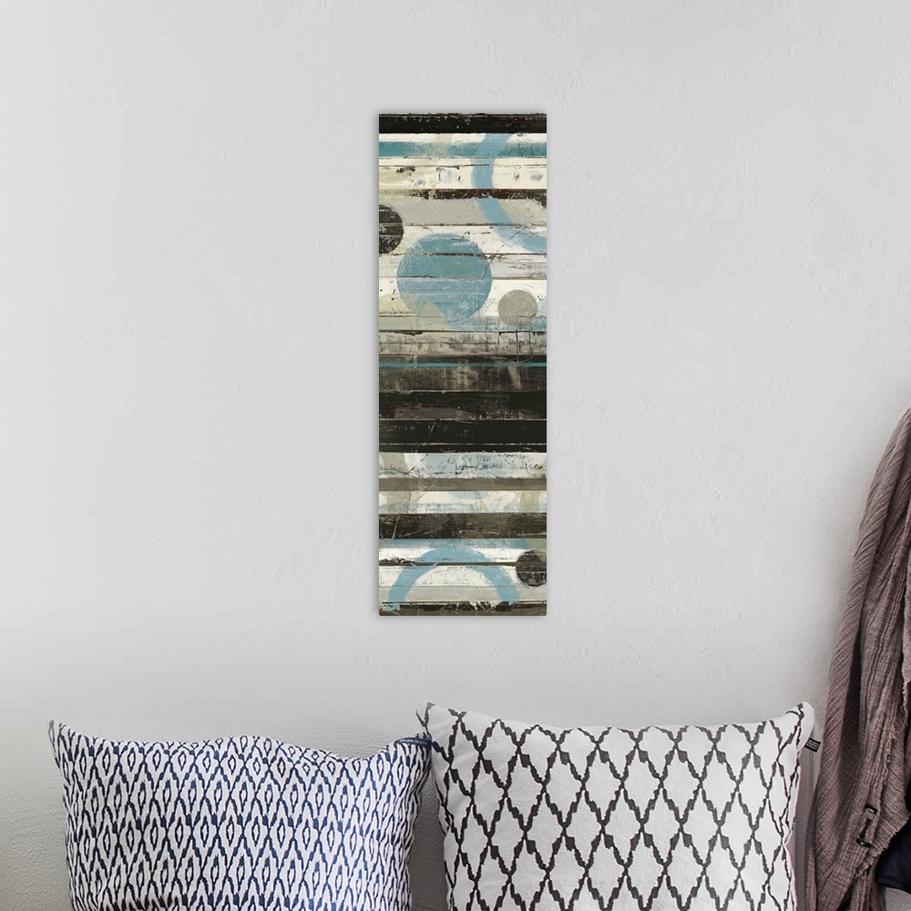 A bohemian room featuring Abstract painting with circles against horizontal stripes in cool tones.