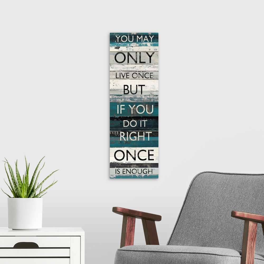 A modern room featuring Contemporary artwork of lines of text stacked vertically against a background of different blue t...