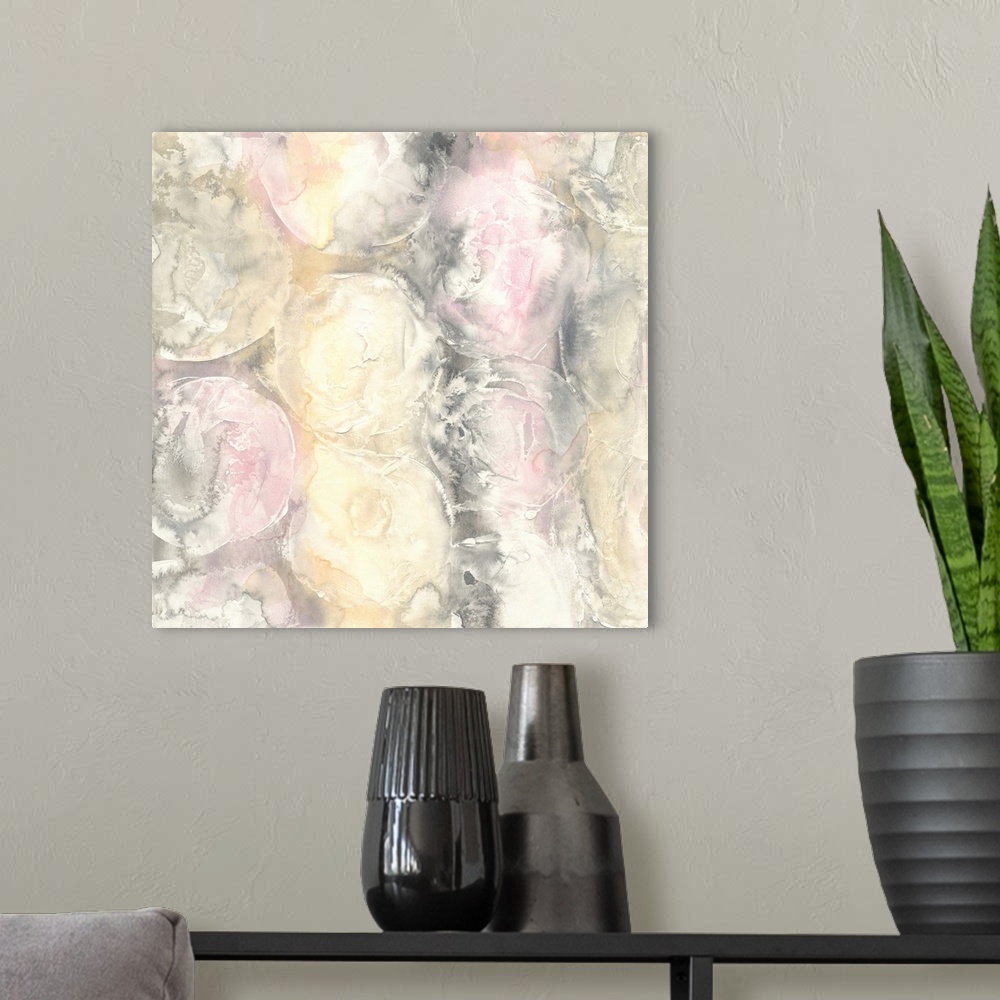 A modern room featuring Abstract artwork with faint circles and texture in light hues of pink, yellow, white, and gray on...