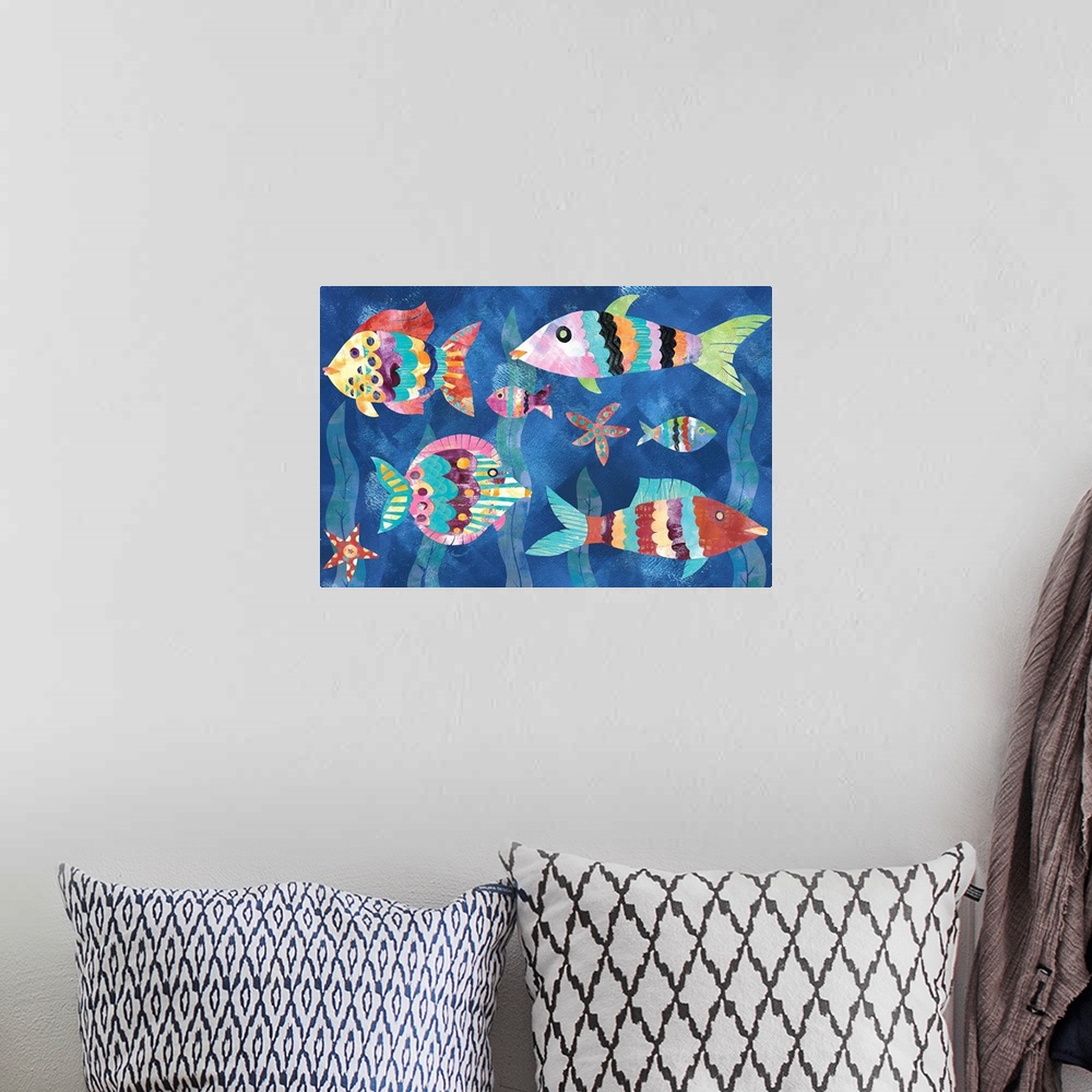 A bohemian room featuring A collage of colorful fish and starfish with seaweed in the background made from mixed media.