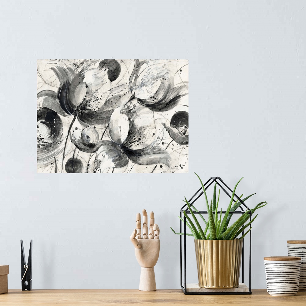 A bohemian room featuring Black and white abstract watercolor painting of flowers.