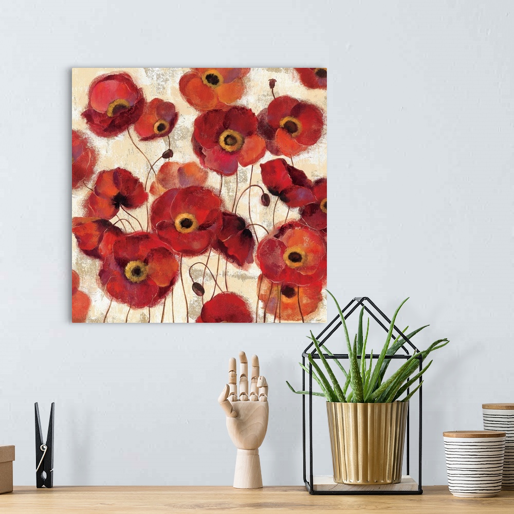 A bohemian room featuring A large square print that contains numerous painted poppy flowers throughout the piece.