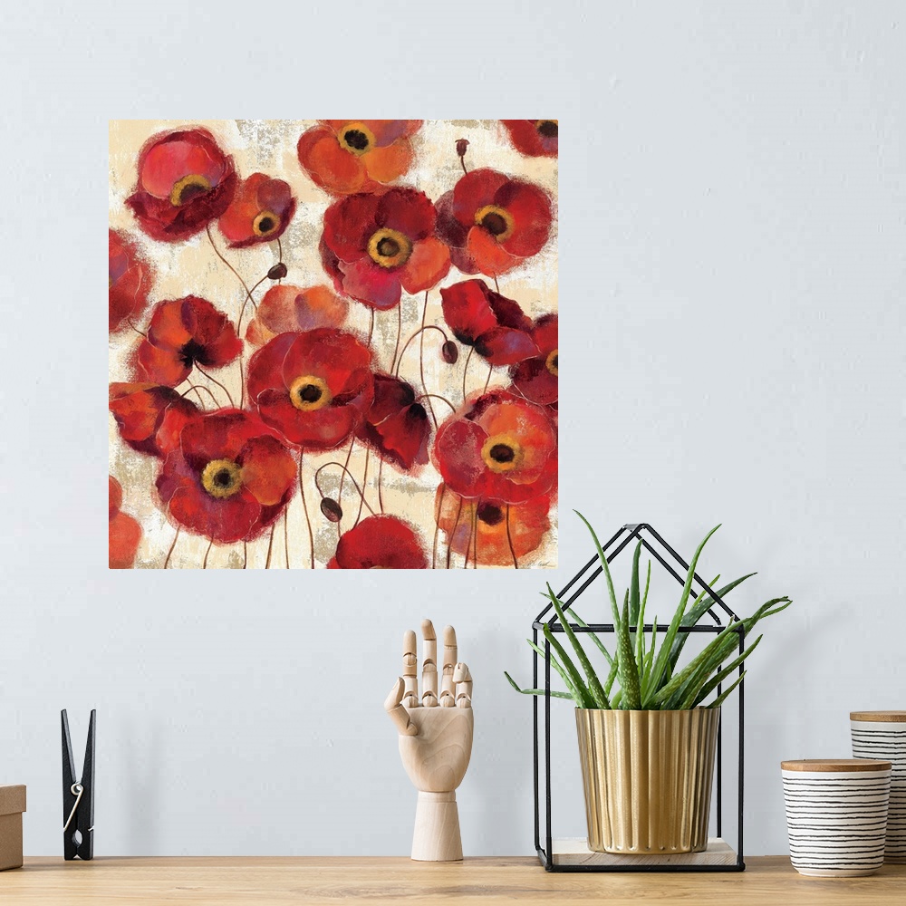 A bohemian room featuring A large square print that contains numerous painted poppy flowers throughout the piece.