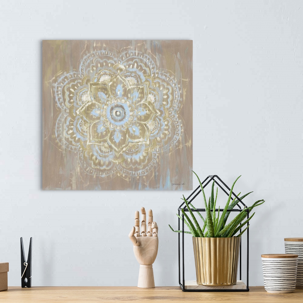 A bohemian room featuring Square decorative artwork of a Mandala style circle on a textured brown background.
