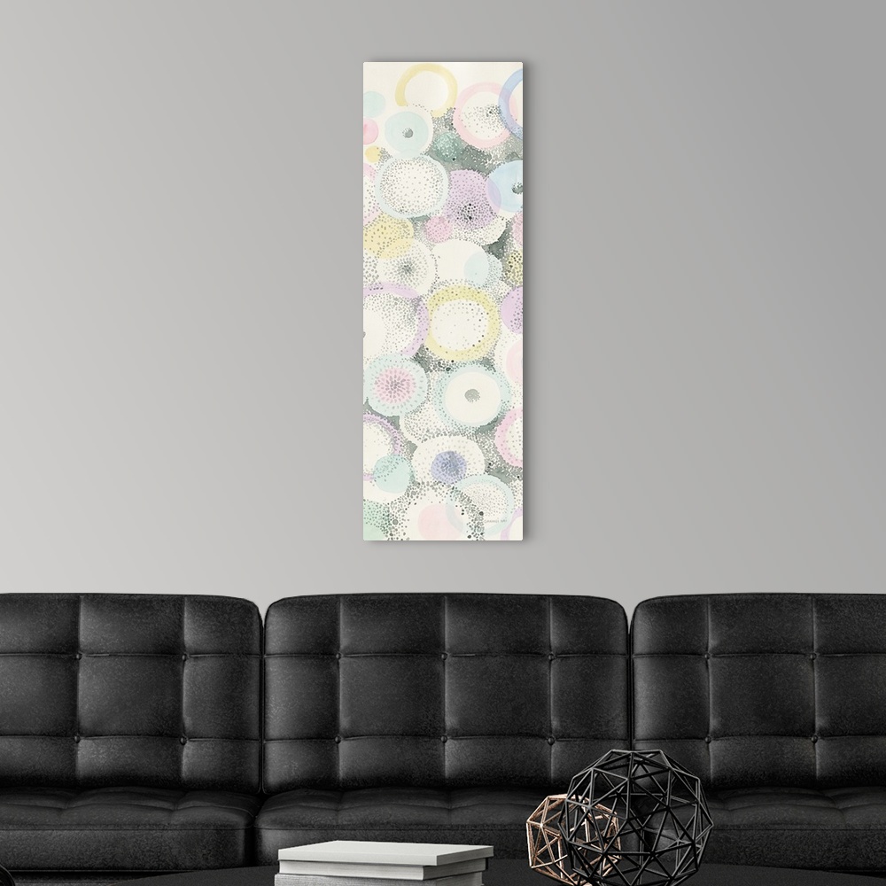 A modern room featuring This contemporary artwork uses pointillism and negative space to create a motif of circular shape...