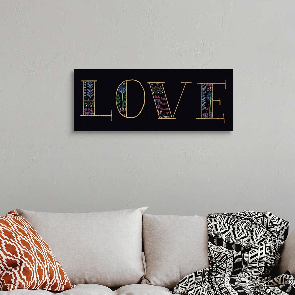 A bohemian room featuring "LOVE" with a floral design on a black background.