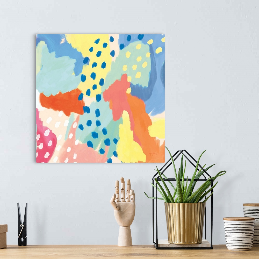 A bohemian room featuring Decorative abstract art featuring brightly colored sections and dots as accents.