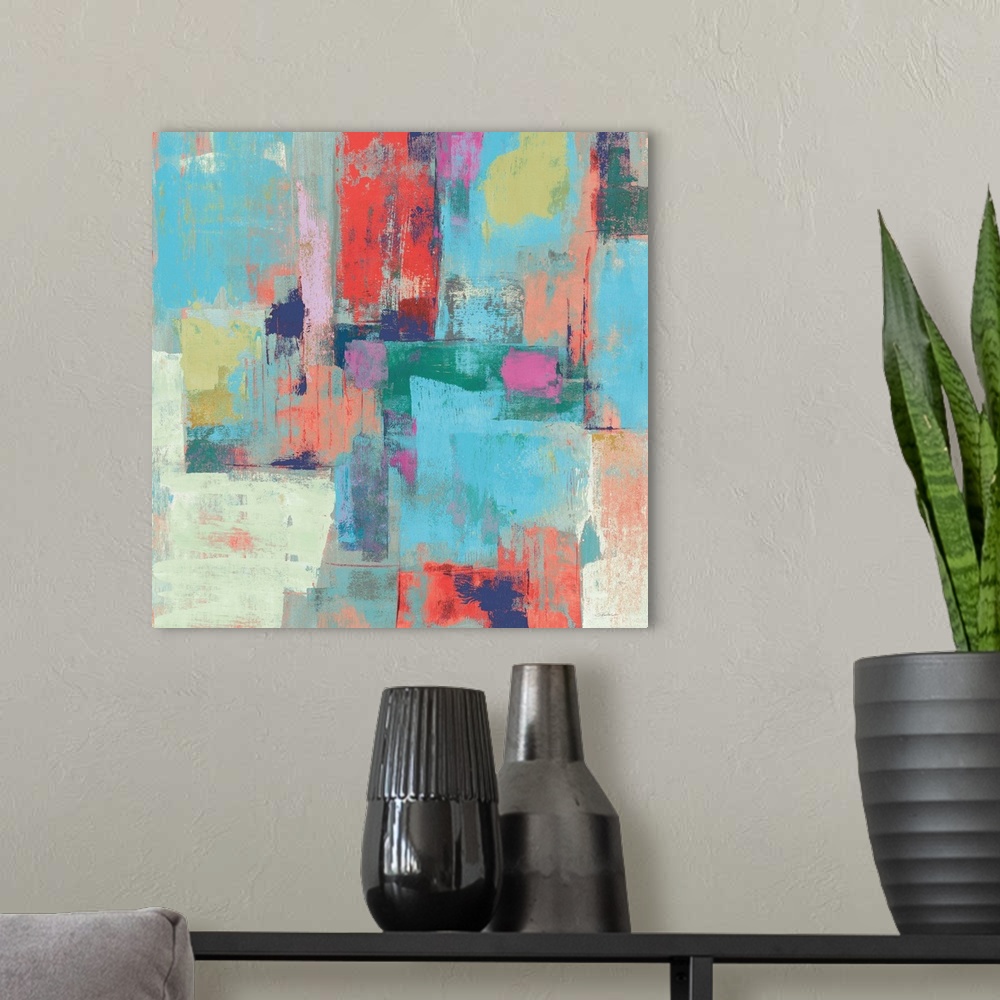 A modern room featuring Colorful abstract painting with layers of color on a square canvas.