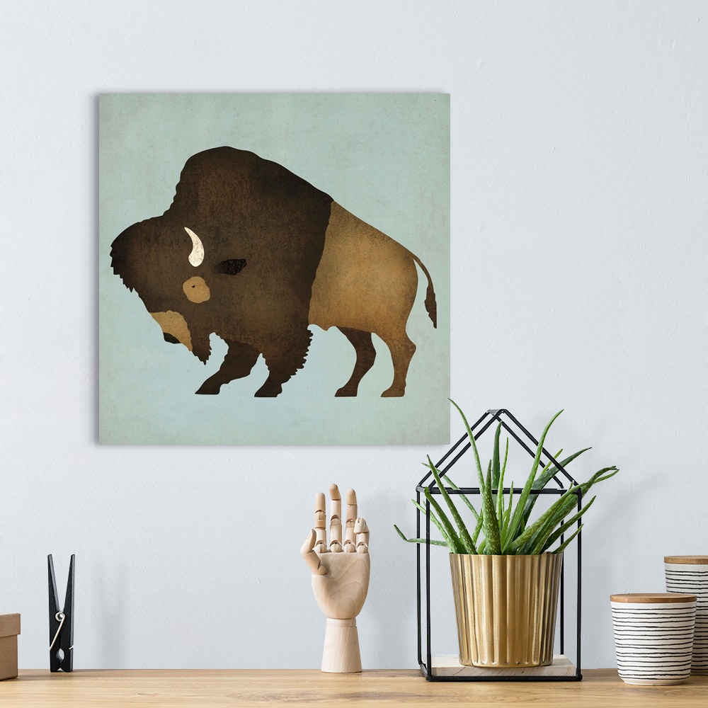 A bohemian room featuring Artwork of a furry buffalo with white horns on a pale blue background.