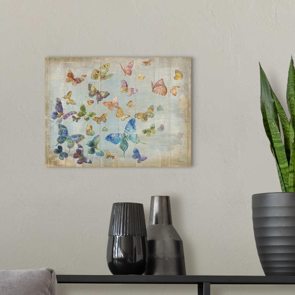 A modern room featuring A flock of butterflies of all different colors flying in the sky.