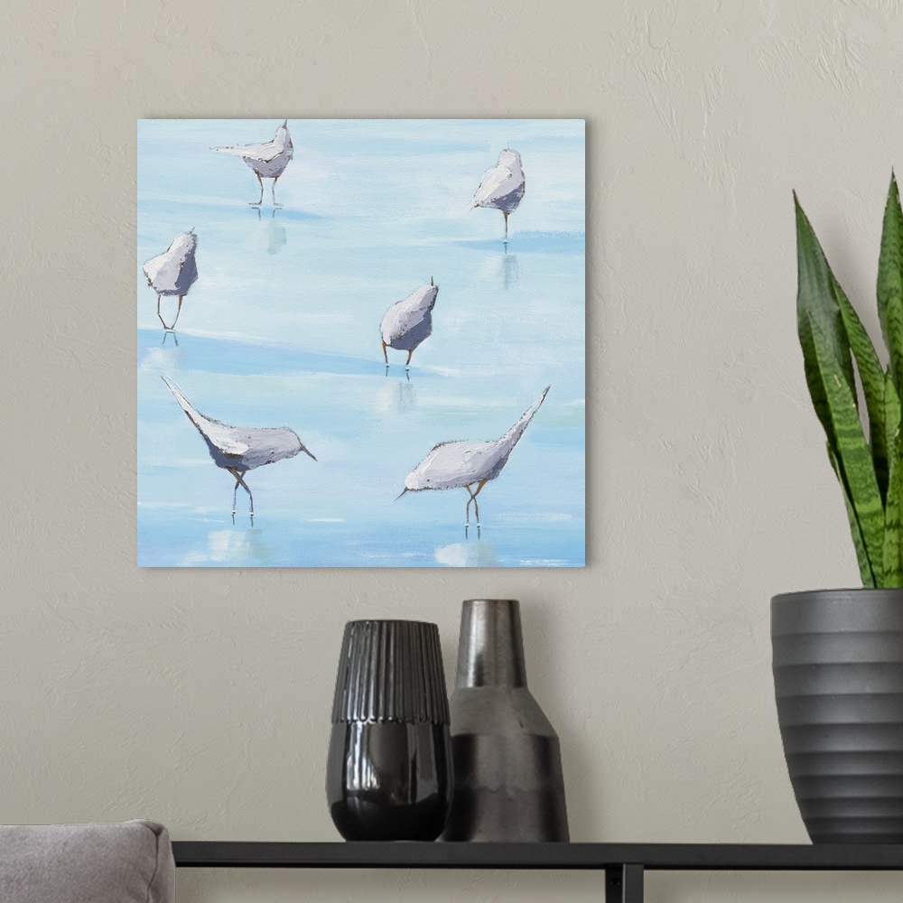 A modern room featuring Square abstract painting of six shorebirds exploring the shallow ocean waters.